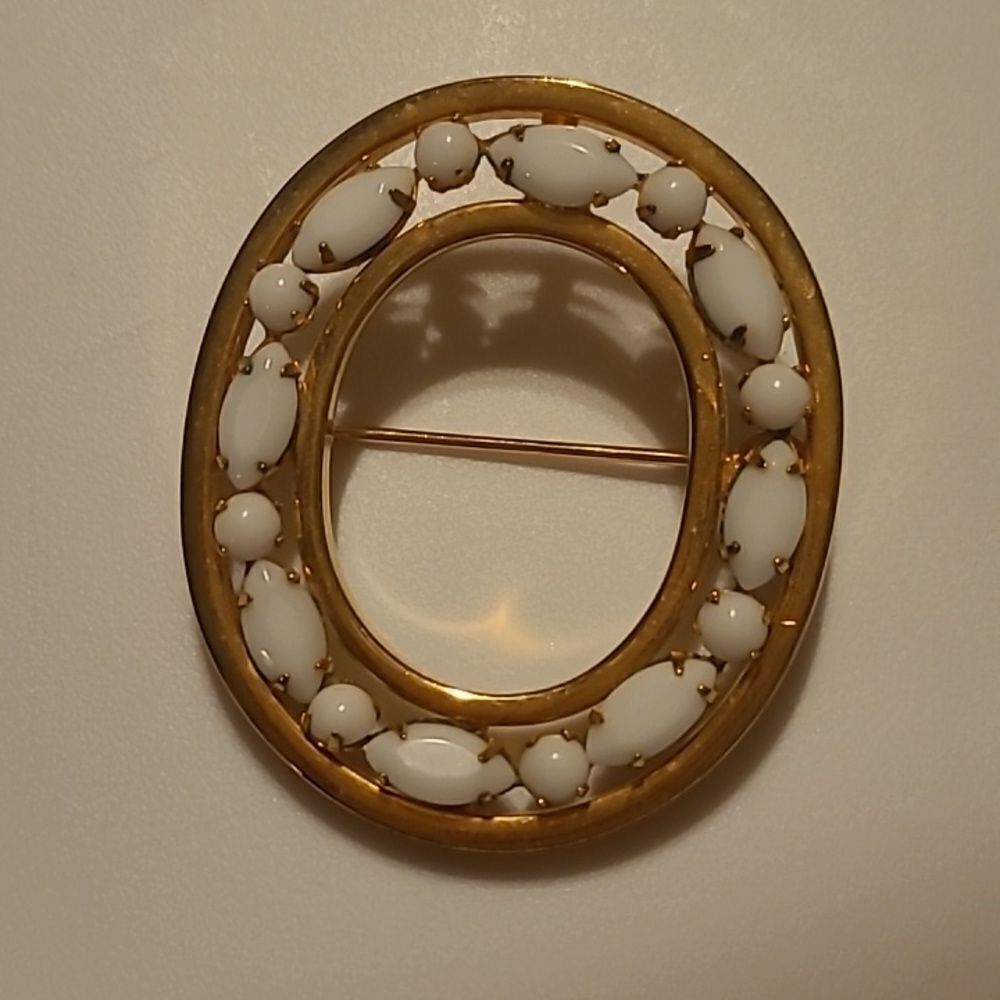 White / Goldtone Brooche